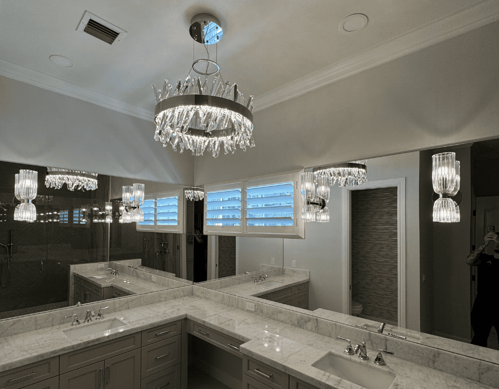 Commercial electrician installing lighting and electrical systems in large interior space