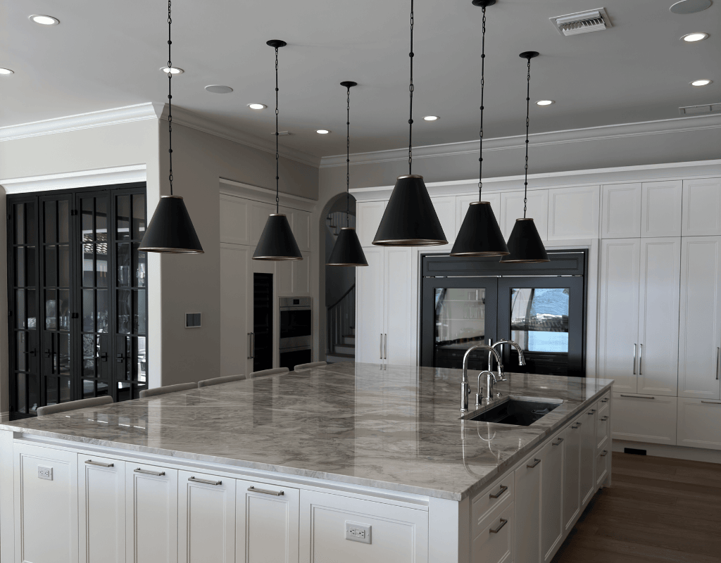 Elegant chandelier and recessed lighting installation in luxury home